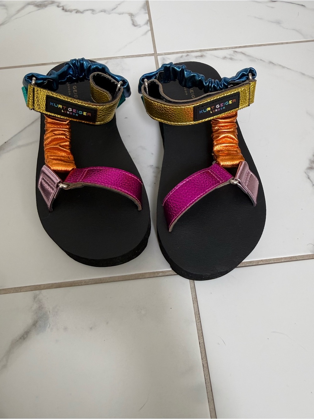 Girls Kurt Geiger Metallic Multicolor Strap Sandals in Pink, Gold, Orange & Blue